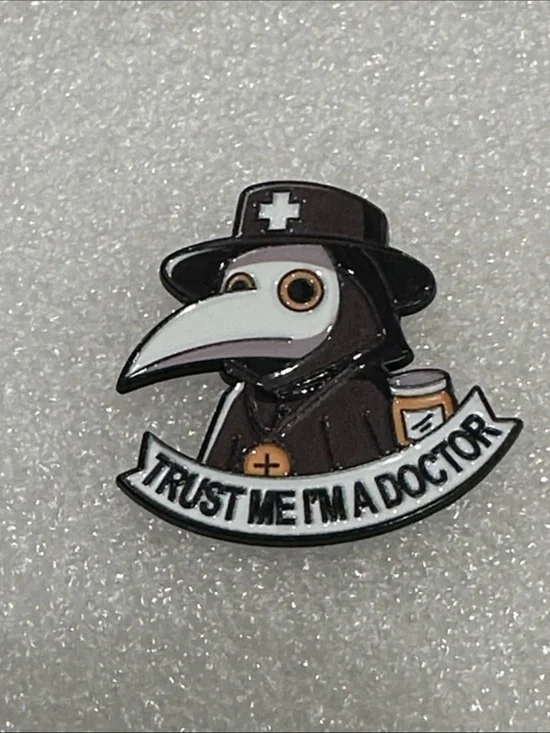 “Trust Me I’m A Doctor” Plague Doctor Enamel Pin - Black, White, Brown