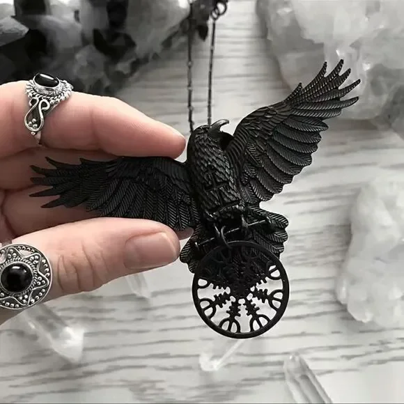 Black raven pendant necklace with black link chain.