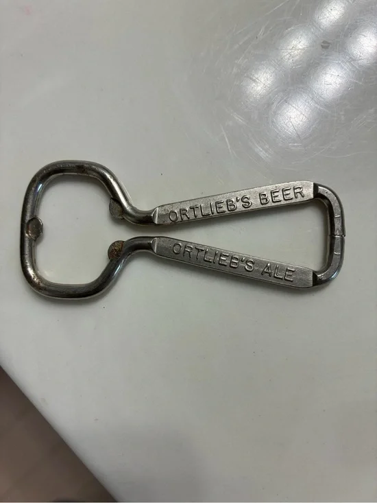 Vintage wire-loop advertising bottle opener from the Henry F. Ortlieb Brewing Co