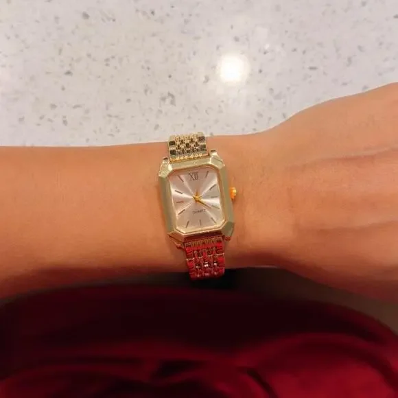Gold vintage small watch with white face