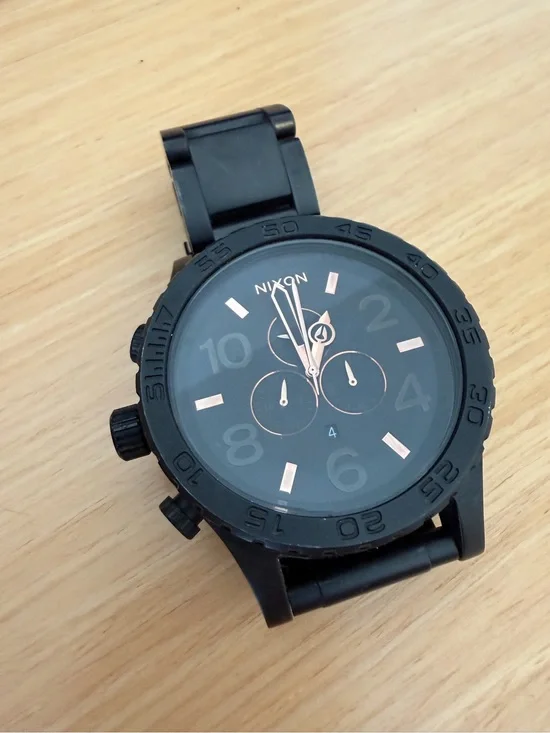Nixon Black Chronograph Watch with Rose Gold Accents