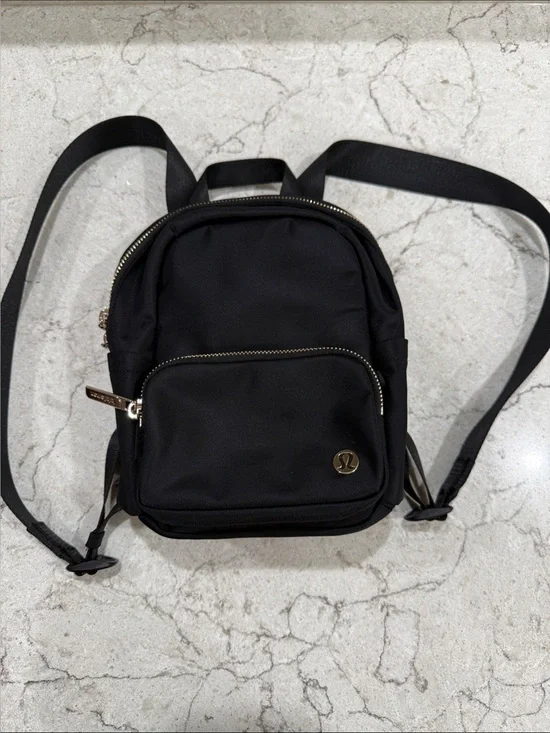 lululemon athletica Black Mini Backpack with Gold Accents. new without tags