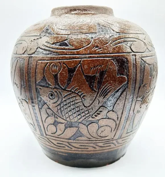 Vintage Asian Pottery Jar featuring designs of Fish, Bird, and Flowers