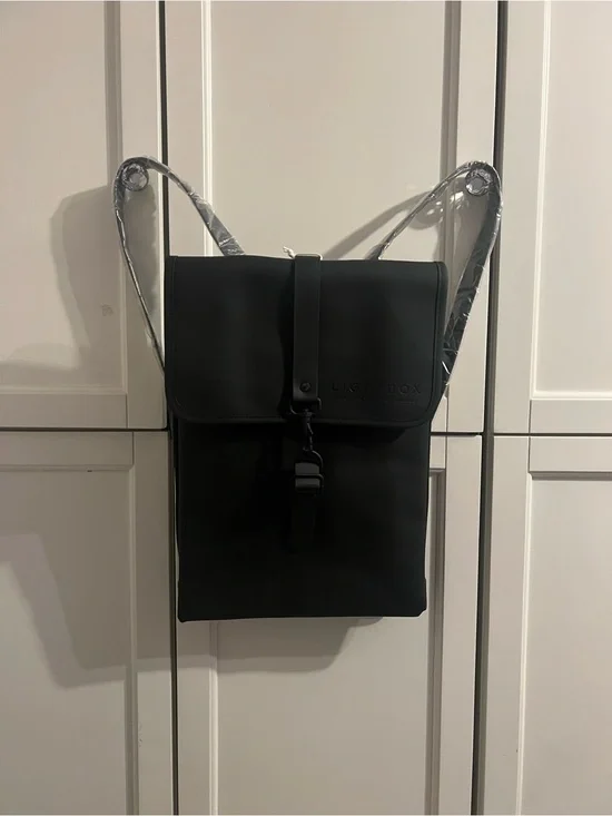 Rains Black Backpack with Front Buckle