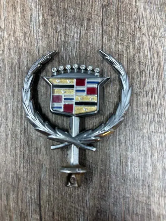 Vintage Iconic GM Cadillac crest and wreath hood ornament emblem with gold birds