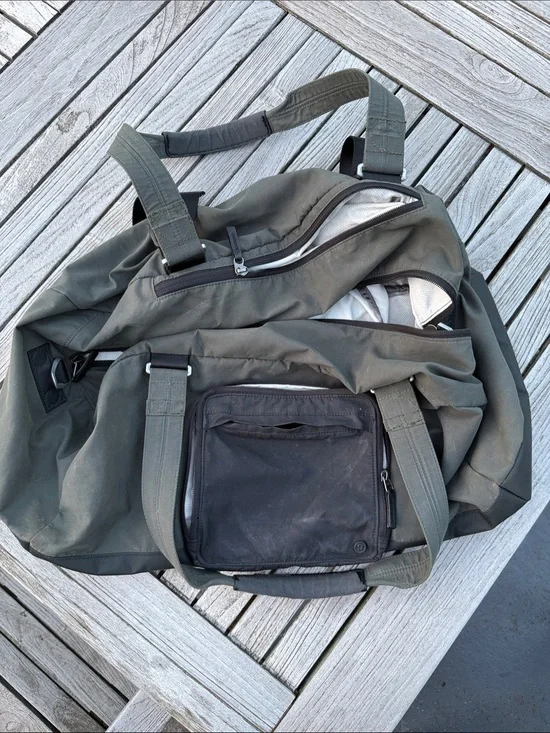 lululemon athletica Olive Green Duffel Bag with Black Pocket. Handles worn