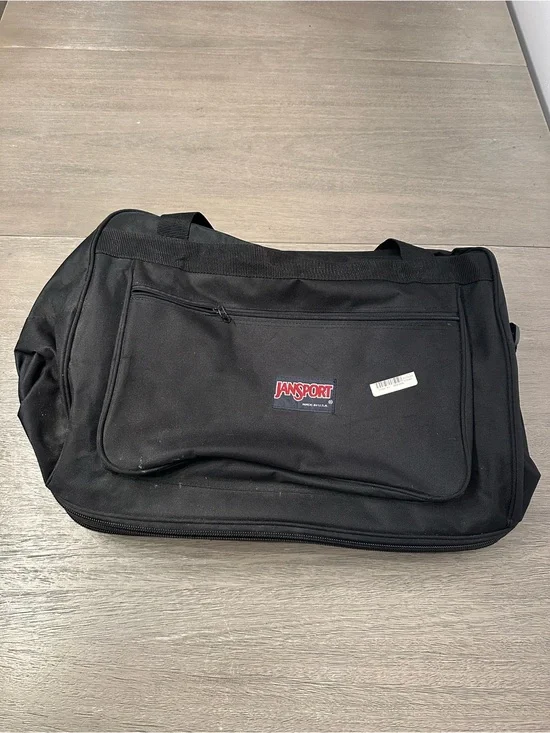Jansport Black Duffel with Front Zip Pocket and wheels