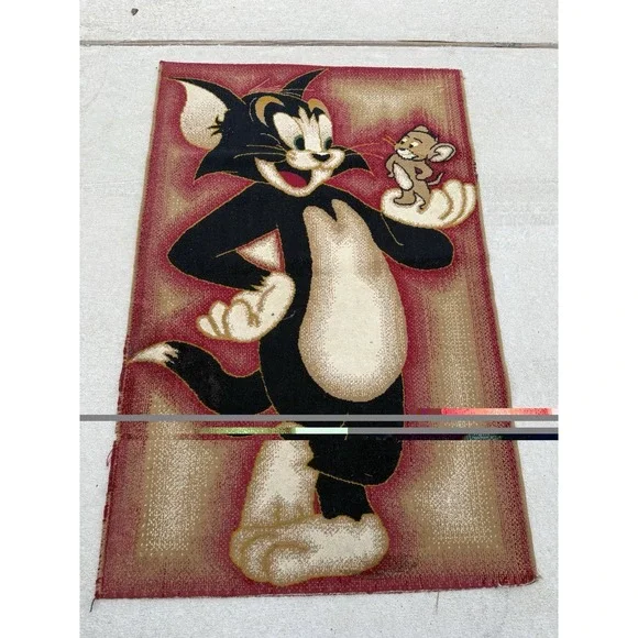 Vintage rug featuring Tom holding Jerry 64x42