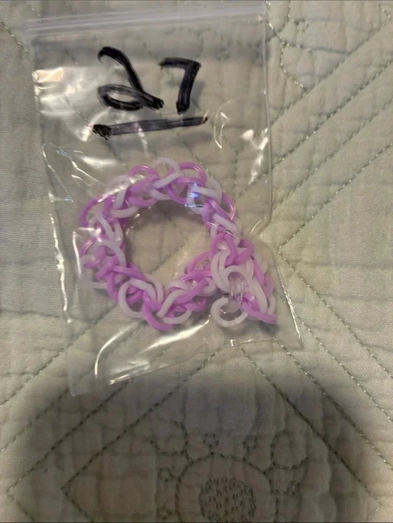 Purple and white rubber band bracelet