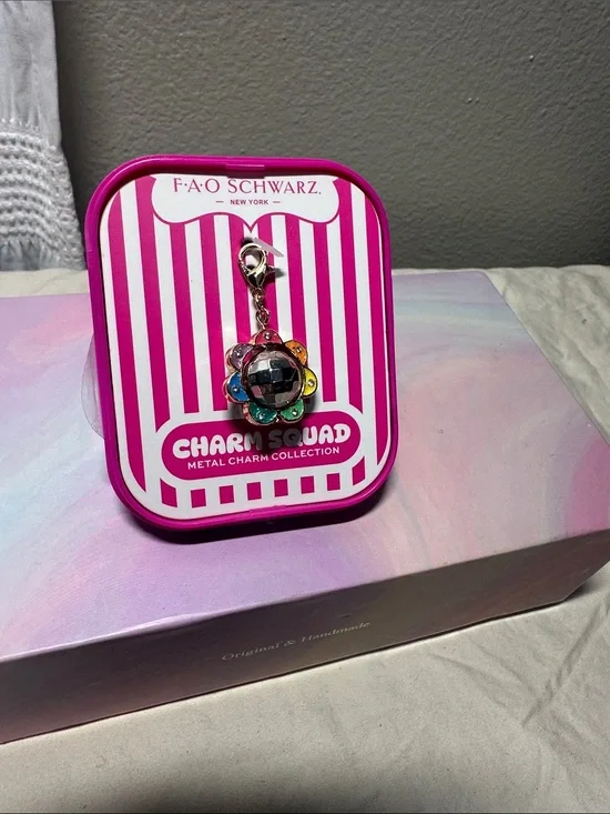 FAO Schwarz Spinning Disco ball with Multicolor Flower Charm NWT