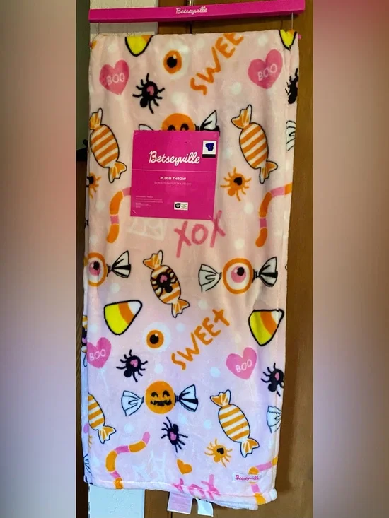 Betseyville 50”x70” plush throw playful Halloween candy pattern