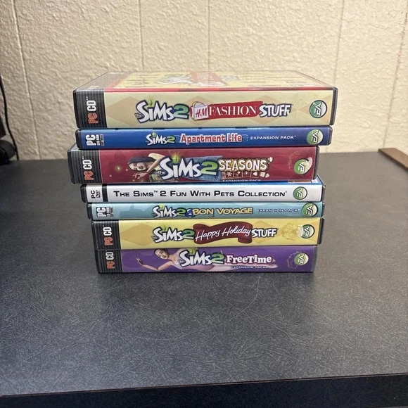 Lot of 7 The Sims 2 PC Game CD ROM Expansion Packs Manuals Complete In Box.