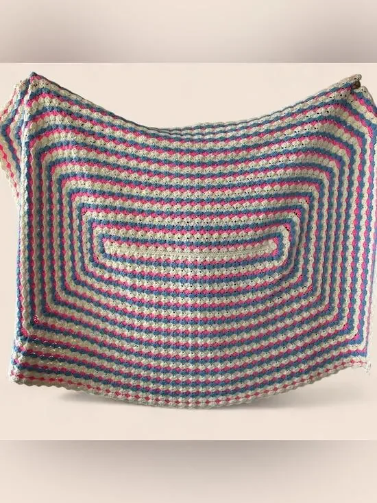 Oversized vintage handmade crochet afghan blanket in pink, blue and cream