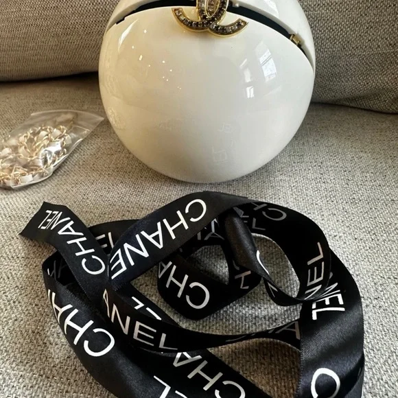 CHANEL White Round Vanity Case with Gold CC Emblem and Black Ribbon