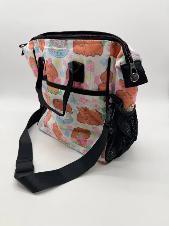 Feifeiyu brand backpack features a colorful cartoon capybara and strawberry prin