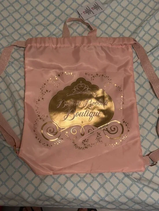 NEW. Disneyland Bibbidi Bobbidi Boutique Pink Satin Backpack.