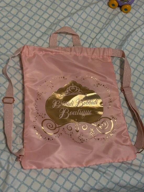 NEW. Disneyland Bibbidi Bobbidi Boutique Pink Satin Backpack.