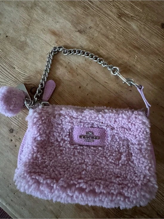Coach Pale Pink Sherpa Chain Wristlet with Pom Charm