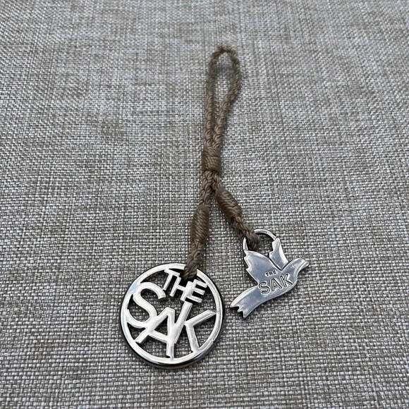 The Sak Silver Metal Hang Tag  Charm Circle Bird Logo Dove Key Fob Replacement