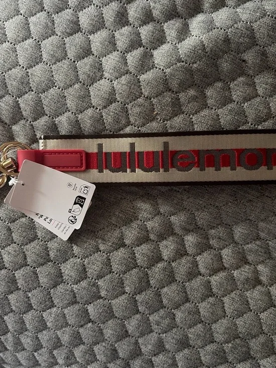 lululemon athletica Key & Card Holder Strap in cream and red