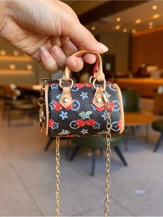 Mini Cherry-Print Coin Bag/Crossbody in Black with Gold Hardware.