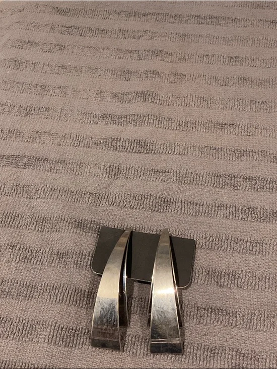 Silver tone earrings.