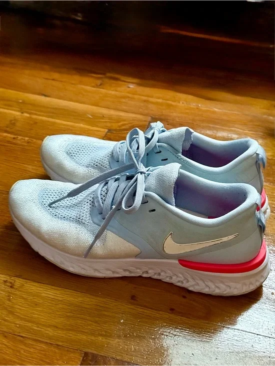 Nike Women's Light Blue Running Shoes with Pink Accent